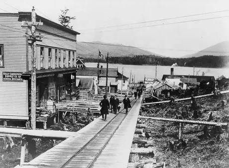 Street railway tracks on a raised wooden street, facing the harbour