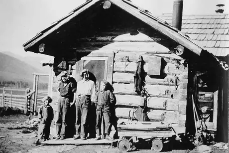Children pose outside their ranch house during the Jasper-Peace River canoe trip