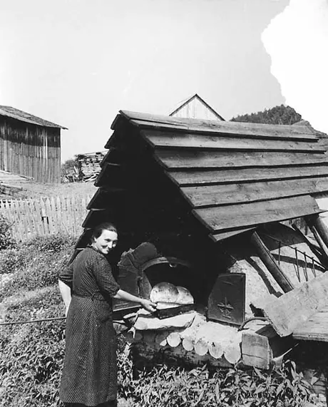 Removing bread from an outdoor bake oven