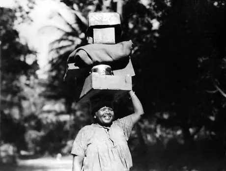 East Indian woman carrying a heavy load