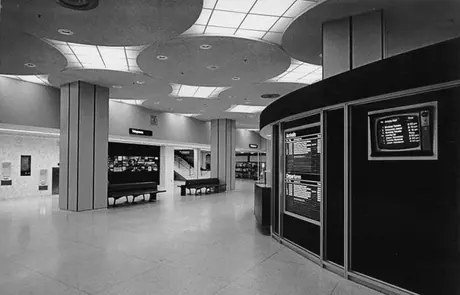 Display at right showing arrivals and departures inside the Canadian National Railway station