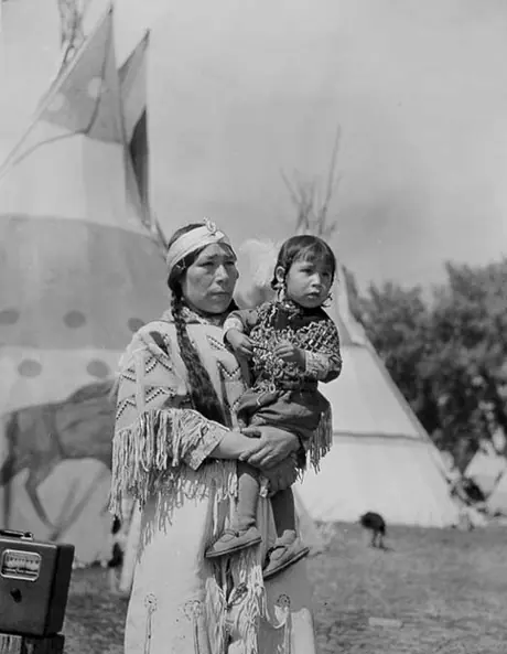 Aboriginal woman holding a child