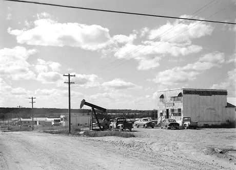 An oil pump on display outside a steel products retail store