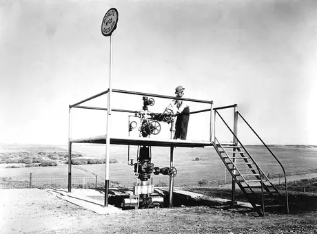 Making adjustments to the equipment at Royalite no. 28 oil well