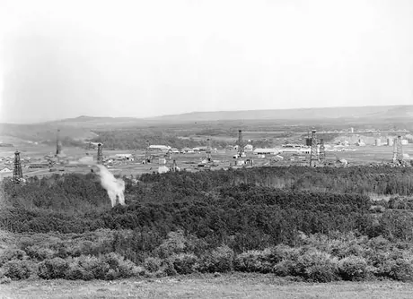 Turner Valley oil fields showing a flame from the MacLeod Group oil wells