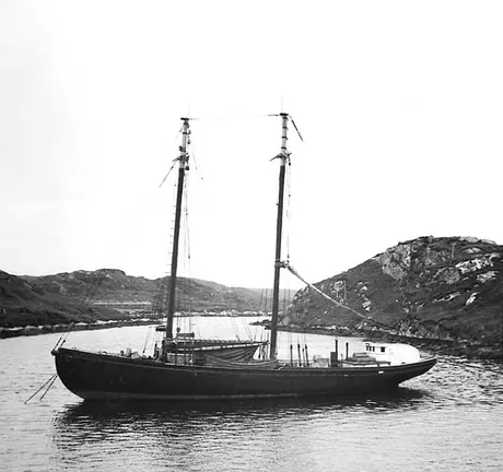 A small fishing schooner at anchor