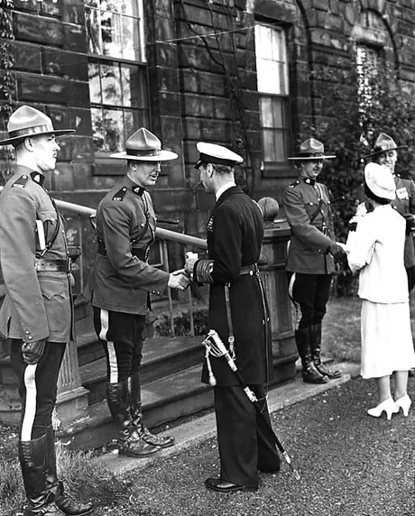 King George VI and Queen Elizabeth speak with members of the Royal Canadian Mounted Police during their 1939 Royal Tour of Canada