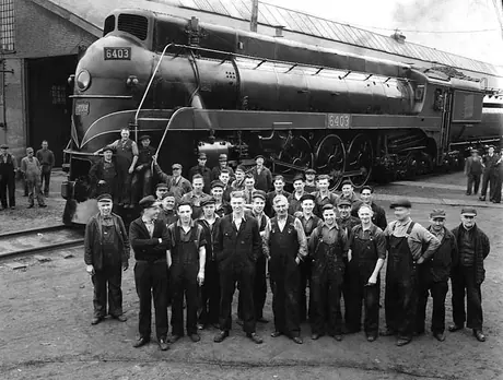 Railway workers pose near Canadian National Railways steam locomotive no. 6403 during the 1939 Royal Tour of Canada