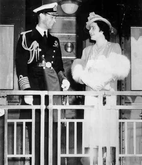 King George VI and Queen Elizabeth on the balcony of the observation car of the Royal Tour train