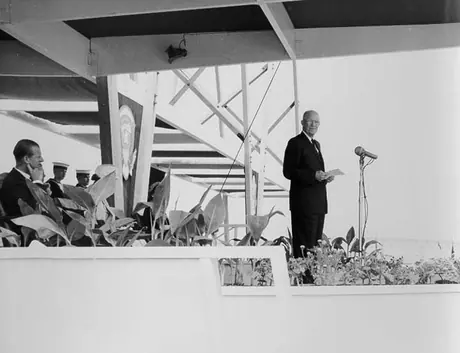 United States President Dwight Eisenhower addresses the crowd during the opening ceremonies for the St. Lawrence Seaway as Prince Philip looks on