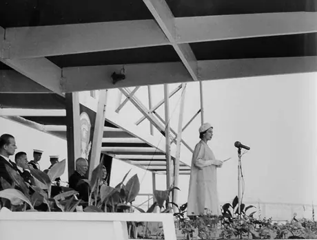 Queen Elizabeth addresses the crowd during the opening ceremony for the St. Lawrence Seaway as Prince Philip and President Eisenhower look on
