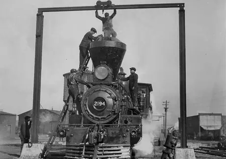 Removing the smoke stack on Grand Trunk Railway steam locomotive no. 2194