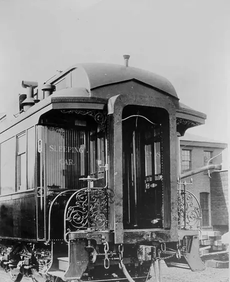 A narrow vestibule railway sleeping car from the 1890's