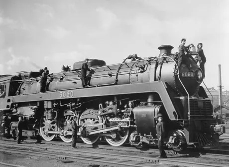 Women railway workers tending Canadian National Railways steam locomotive no. 6060 during the Second World War