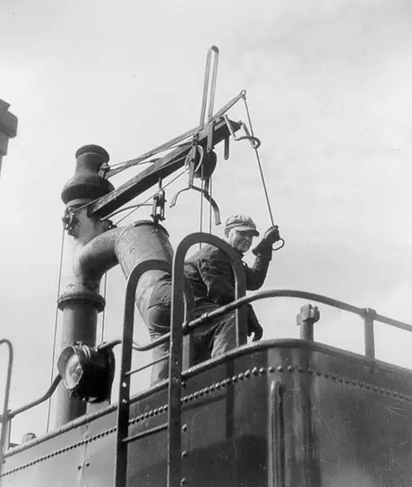 Taking water aboard a steam locomotive