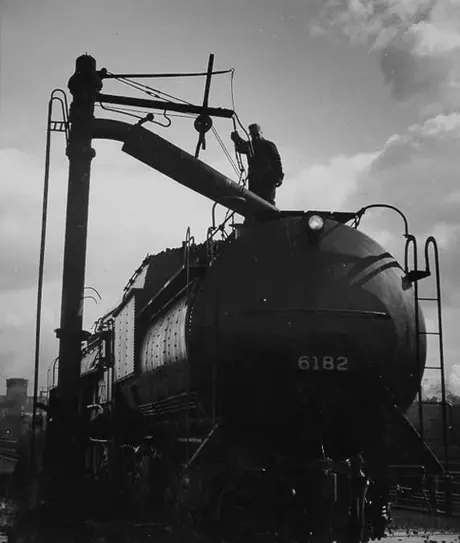 Taking water into the tank of Canadian National Railways steam locomotive no. 6182