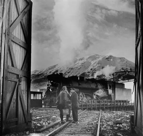 Two Canadian National Railways locomotive engineers beside the turntable at the Jasper Railway yards