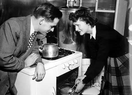 Dr. and Mrs. Mclean in the kitchen of the dental car