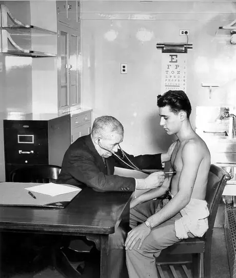 Doctor examining patient in the medical car
