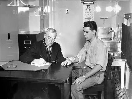 Doctor examining patient in the medical car