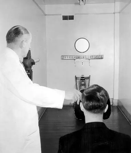Doctor performing an eye exam at the CN medical clinic, Moncton