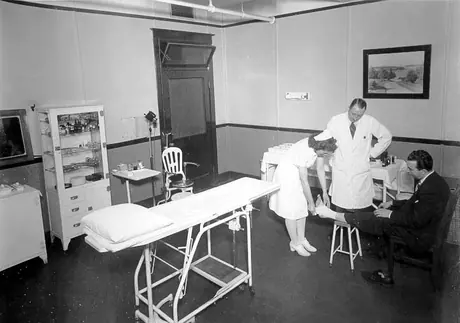 Patient having his foot bandaged at the medical department clinic, Montreal