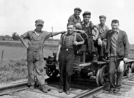 Track gang ready to leave for assignment on motor scooter and trailer