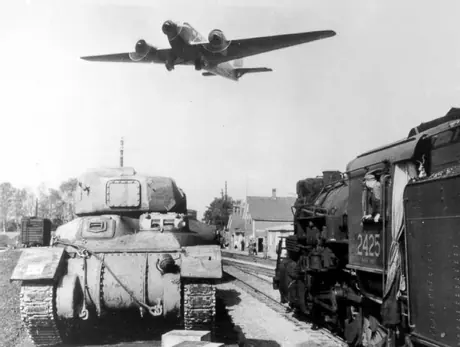Tank waiting for movement to Halifax, as bomber flies over the area