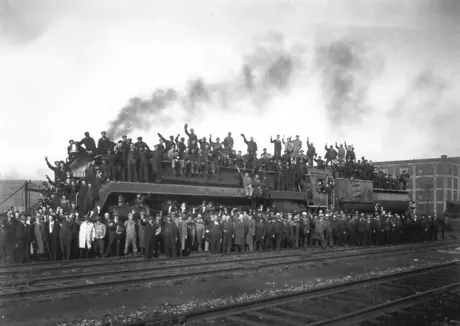 CN employees posing on steam locomotive 6060 for 7th Victory Bond drive