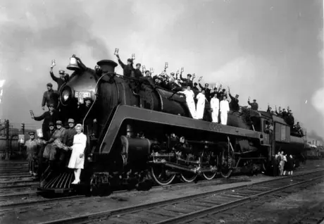 CN employees posing on steam locomotive 6060 for 7th Victory Bond drive