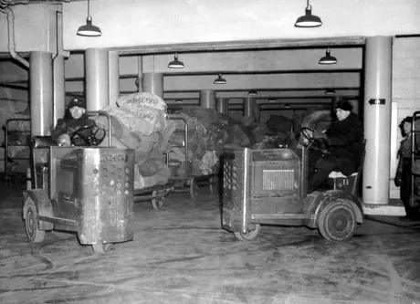 Central Station employees maneuvering Christmas mail