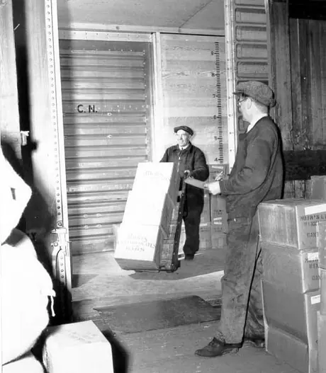 Unloading freight from the interior of aluminum box car