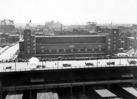 Gun salute honouring the birthday of King George VI, Central Station in the background