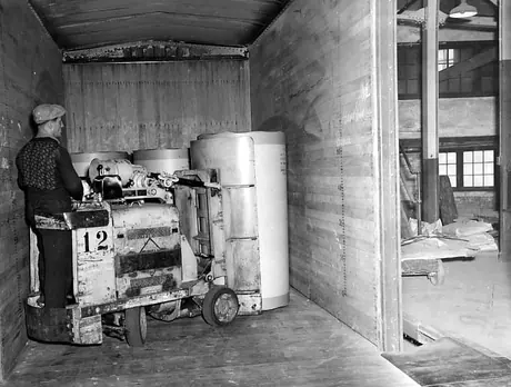 Loading paper into a CNR freight car at the Consolidated Paper Co.