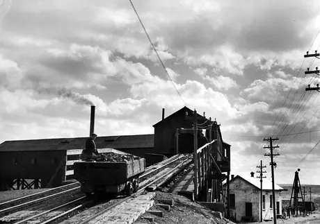 Mine cars being hauled up to loading trestle