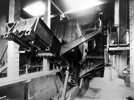 Unloading grain within elevator