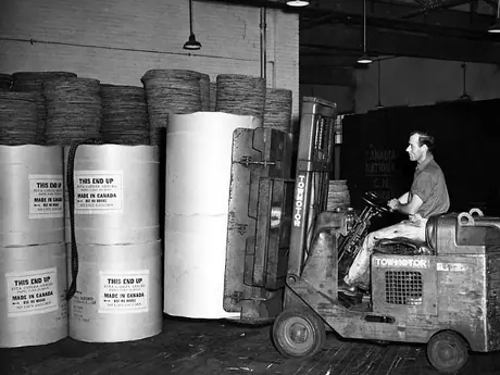 Moving paper within warehouse of the Price Brothers Co. plant