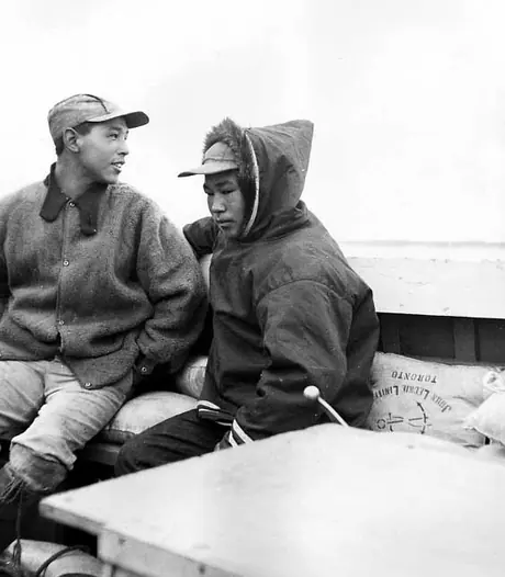 Two Inuit boys in a boat