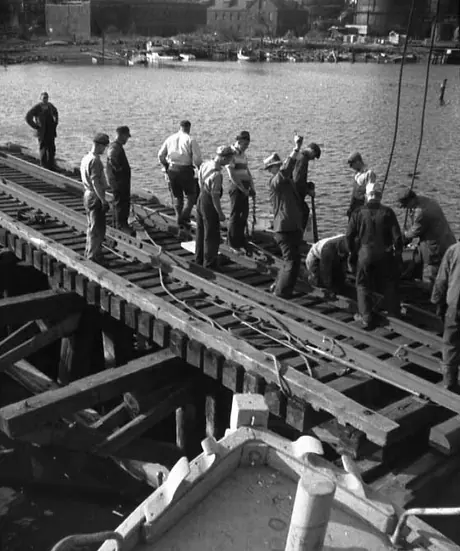 Hurricane damage affecting the Central Vermont Railway docks at New London, Connecticut - repairs to a jetty