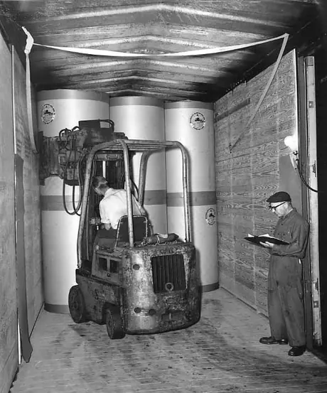 Loading Anglo-Canadian Pulp & Paper Mills Ltd. Paper rolls into a test car.