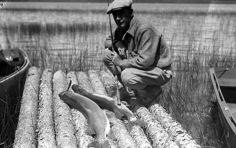 Mr. Cooper with a pair of twenty pounders caught on Cliff Lake