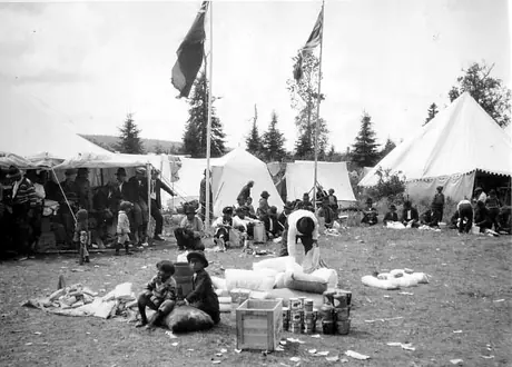 Ojibwa Amerindians with their provisions (sacks of flour, canned goods, packaged foods) during Northwest Angle Treaty 3 Day