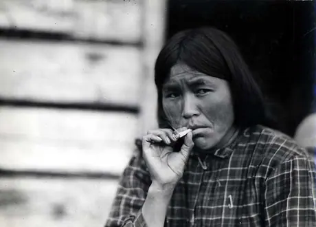 Stuart Lake woman in plaid blouse, smoking