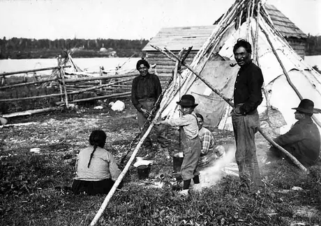 Ojibwa families making tea at campfire