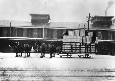 Canadian National Express Company historic shipment on a sleigh in winter.
