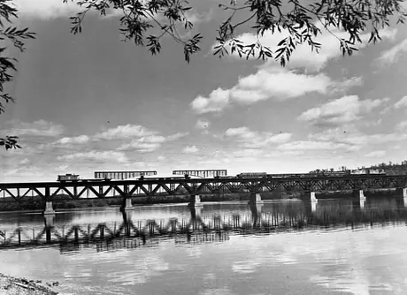 Haunch girders being transported on the Central Vermont Railway by a Boston and Maine Railraod train.