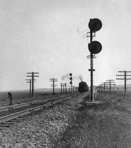 Centralised Traffic Control signals at a passing siding at Dorchester, NS, with an eastbound local freight train.