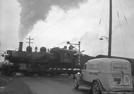 Model 10 grade crossing signal at Port Credit, ON.  Steam locomotive E-10-a 2-6-0 915.