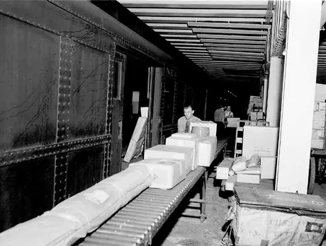 Moving parcels between freight train and the express transfer platform