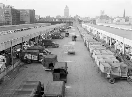 Dozens of freight and express trucks receiving shipments, Bonaventure Station